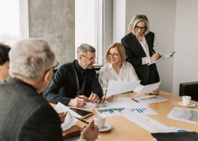family meeting around a board table